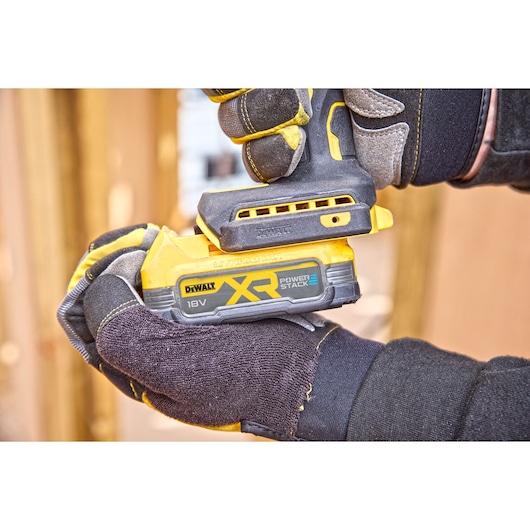 Powerstack battery being attached to DCF870 18V XR Brushless impact driver