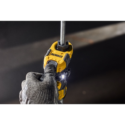 User pushing home button on Dewalt Nut Runner Attachment